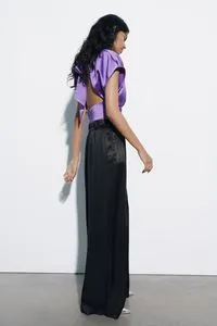 SATIN TOP WITH KNOT offers at 179 Dhs in Zara